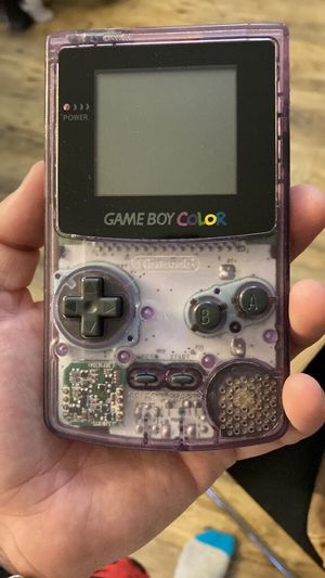 An atomic purple Game Boy Colour, looking clean and almost new
