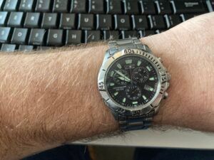 A silver citizen eco-drive watch on a wrist.